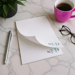 Thick monogrammed writing pad with custom initials, smooth paper, and clean space for notes.