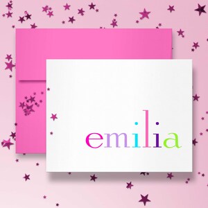 A hot pink envelope with a rainbow stationery card makes a cheerful kids birthday gift set of custom thank you cards.