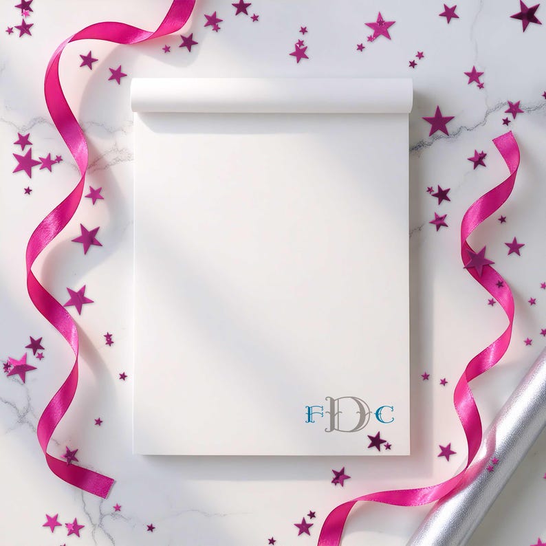 Monogrammed pad with smooth paper and personalized initials, useful for daily lists and quick reminders.