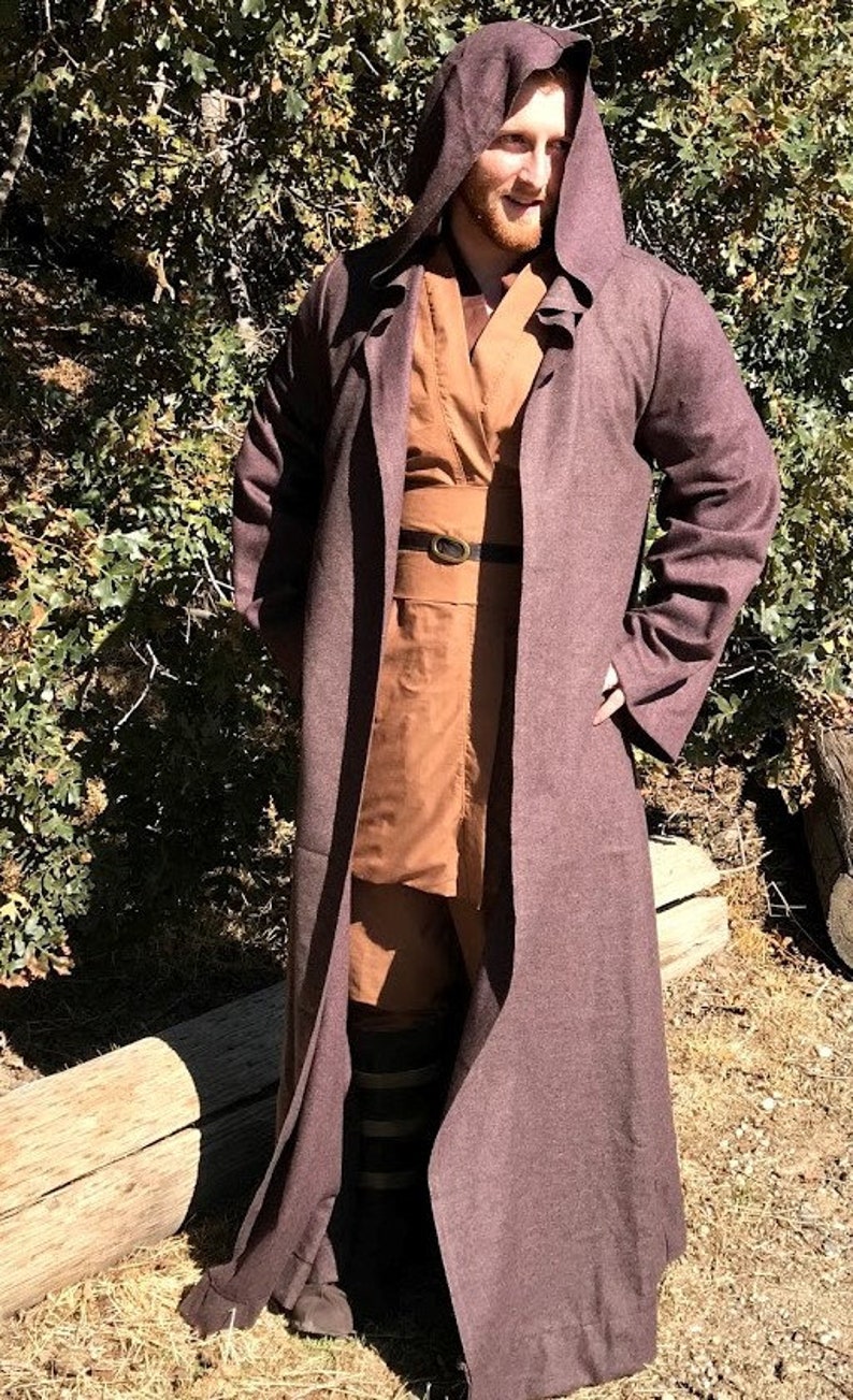 May include: A brown hooded robe with a brown belt and a brown undershirt. The robe is made of a soft, textured fabric.