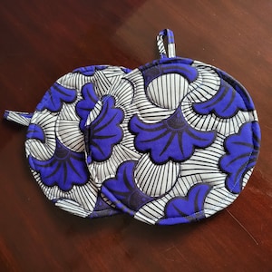 Blue black white floral wax cloth quilted round potholders