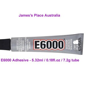 May include: A silver tube of E6000 Industrial Strength Adhesive. The tube is labeled with the brand name and product information. The tube is 5.32 ml or 0.18 fl oz and weighs 7.2 grams.