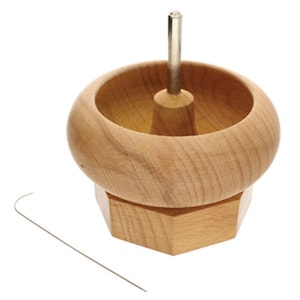 May include: Wooden bead winding stand with a metal pin and a wire hook. The stand has a hexagonal base.