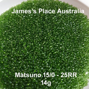 May include: A close-up image of a large quantity of small, green glass seed beads. The beads are in a white bowl. The text "James's Place Australia" and "Matsuno 15/0 - 25RR 14g" is visible in the image.