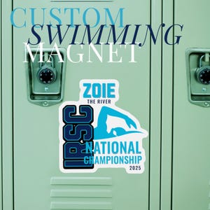 May include: A blue and white custom swimming magnet with the text "ZOIE THE RIVER" and "NATIONAL CHAMPIONSHIP 2025". The magnet features a swimmer in a blue silhouette.