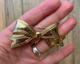 Gold bow brooch 80's