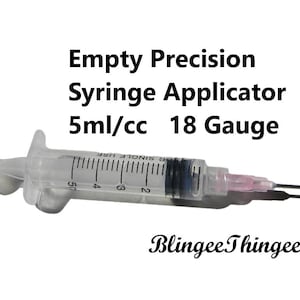May include: A clear plastic syringe applicator with a 5 ml/cc capacity and an 18 gauge needle. The syringe is labeled "Single Use" and has markings for measuring liquid.