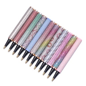 May include: A set of ten sparkly pens with different coloured glitter and patterns. The pens have gold accents and black ink.