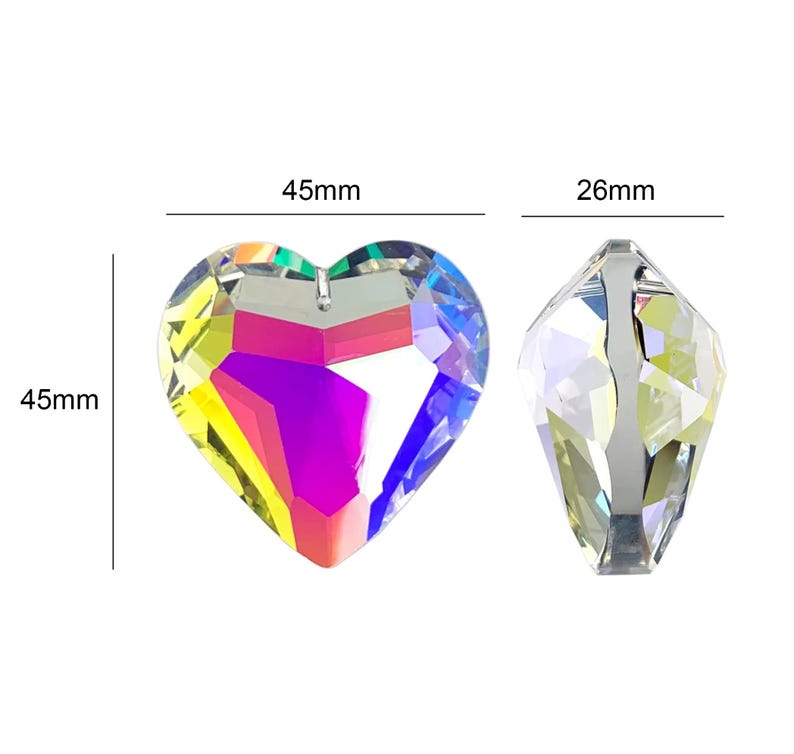 May include: Two crystal prisms, one shaped like a heart and the other a teardrop. The heart prism is 4.5 inches wide and 4.5 inches tall. The teardrop prism is 2.6 inches tall. Both prisms have a rainbow iridescent finish.