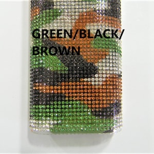 May include: A close-up of a green, black, and brown camouflage pattern made of rhinestones. The text "GREEN/BLACK/BROWN" is printed on the pattern.
