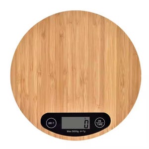 May include: A round, wooden kitchen scale with a black digital display. The scale has a maximum weight capacity of 5000 grams and an accuracy of 1 gram. The scale has buttons for "unit", "on", and "tare".