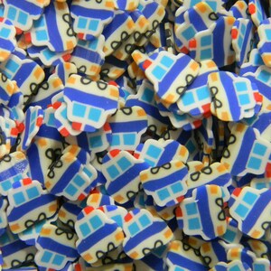 May include: A large pile of small, blue, white, and orange plastic toy police cars. The cars have black details and are all facing the same direction.