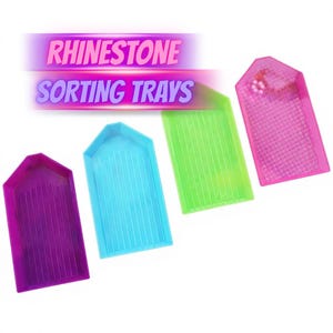 May include: Four plastic sorting trays for rhinestones in purple, blue, green, and pink. Each tray features a pointed top, a rectangular base, and internal vertical ridges. The text RHINESTONE SORTING TRAYS is displayed above the trays.