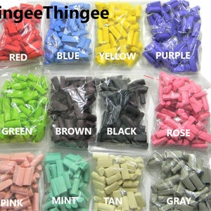 May include: Assortment of small plastic pieces in various colors, including red, blue, yellow, purple, green, brown, black, rose, pink, mint, tan, and gray. The pieces are packaged in clear plastic bags with labels indicating their color.