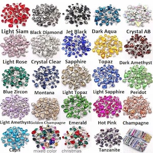 May include: Assortment of colorful rhinestones in various shapes and sizes, including light siam, black diamond, jet black, dark aqua, crystal AB, light rose, crystal clear, sapphire, topaz, dark amethyst, blue zircon, montana, light topaz, light sapphire, peridot, light amethyst, golden champagne, emerald, hot pink, champagne, capri, mixed color, christmas, and tanzanite.