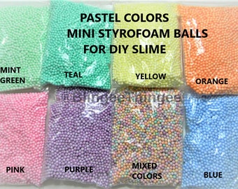 May include: Eight bags of pastel-colored mini styrofoam balls for DIY slime. The bags are labeled with the colors: mint green, teal, yellow, orange, pink, purple, mixed colors, and blue.