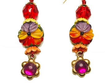Colorful Handcrafted Lamp Works Floral Dangle Earrings with Red Austrian Crystal Beads, Ceramic Bead Caps and Brass Magenta Flower Dangles