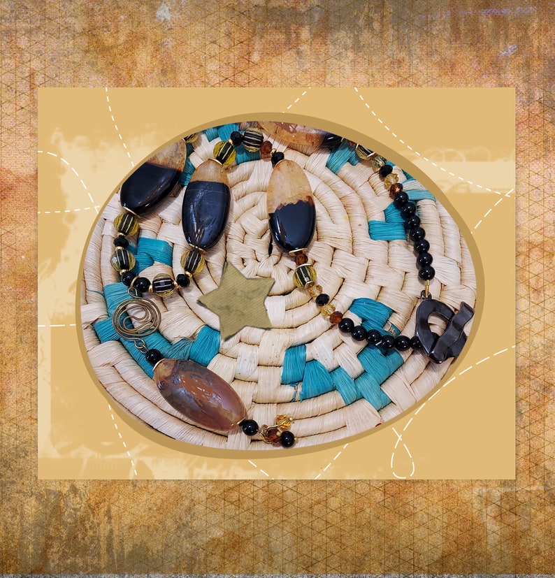 May include: A collection of handcrafted jewelry pieces, including a necklace and earrings, featuring dark, oval-shaped beads with lighter accents. The jewelry is displayed on a woven basket with turquoise and natural tones, and a star-shaped charm.