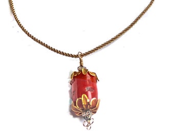 Large Red Coral Pendant, Natural Gem,  Rope Neck Wire, features a large Red Barrel Shape Pendant, Gold Plated Neck Wire, Lovely Gold Finding