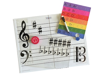 May include: A white magnetic dry-erase board with a treble clef, bass clef, and musical notes. The board includes a set of colorful magnetic circles with letters and sharps, a red marker, and a red magnetic note.