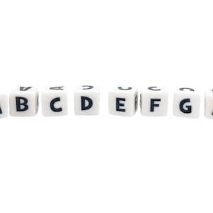 May include: White letter blocks spelling out the alphabet from A to G.