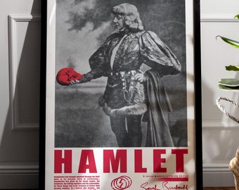 May include: Black and white poster with a grayscale image of a person in a costume holding a red object. The poster has the word "HAMLET" in red letters and the text "Sarah Bernhardt" in black letters.