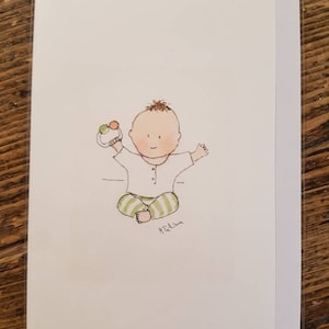 Carte bébé garçon, un petit garçon avec son hochet. Fait à la main et imprimé à partir d'une aquarelle originale, vierge à l'intérieur.