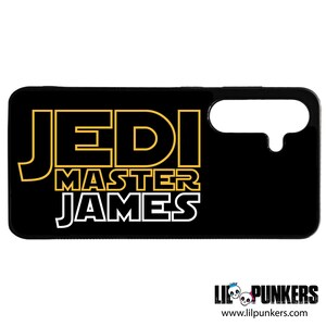 May include: Black phone case with a yellow outline of the text "Jedi Master James".