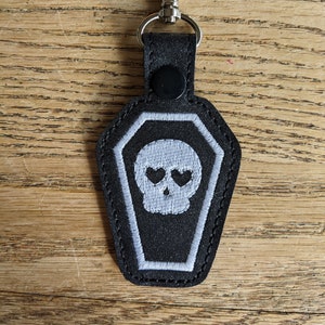 Coffin with Glow In the Dark skull. Embroidered Key chain