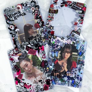 May include: Four clear, decorative phone cases with photos of a woman. Each case is embellished with various charms, stickers, and text, including "knock knock", "Who's There", "Queen of Hearts", and "make a wish". The cases have a glittery, whimsical aesthetic.