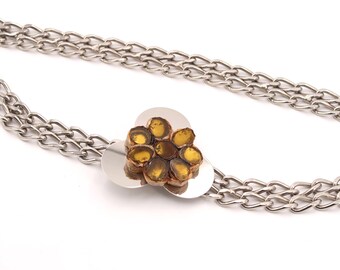 LINE VAUTRIN school : chain belt with talosel decor on the buckle, 1970s or 1980s / jewelry, French mode