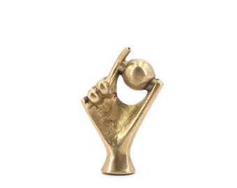 Brass paperweight, Hand holding a sphere, 1950s / talisman, desk, charm