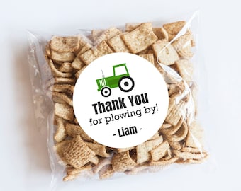 May include: Green tractor thank you favor tag with the text "Thank you for plowing by! - Liam -" on a white background. The tag is attached to a small bag of cereal.