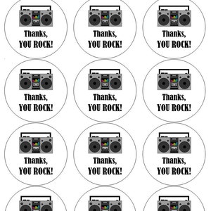May include: Nine round white stickers with a black and grey boombox graphic and the text "Thanks, YOU ROCK!" printed in black.