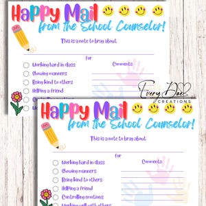 May include: Two printable 5x7 inch cards with a happy mail theme. The cards are white with a purple border and feature a smiling pencil, a flower, and a handprint design. The text on the cards reads "Happy Mail from the School Counselor!" and includes a list of positive behaviors for students to be recognized for.