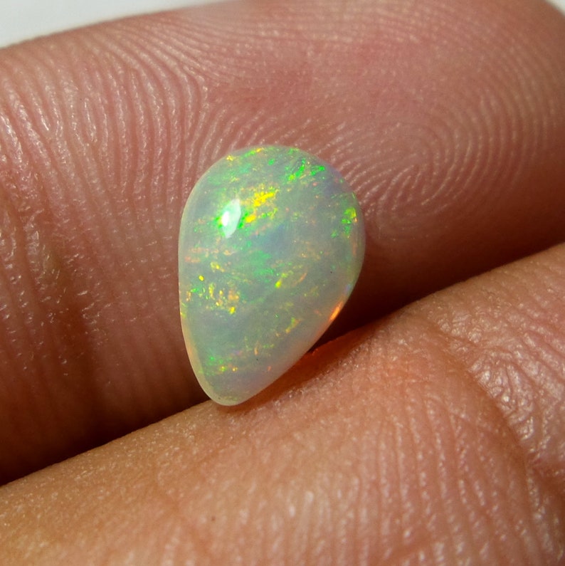 0.92 Carat 9.8x6.8x3.3 MM Rare Quality Ethiopian Multi Color Opal Pear Shape Cabochon