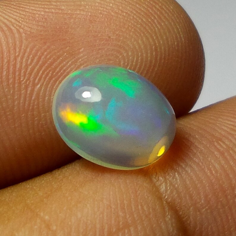 2 Carat 11.2X8.9X5.1 MM AAA Grade Natural Ethiopian Welo Fire Opal Oval Shape Cabochon Multi Color Opal