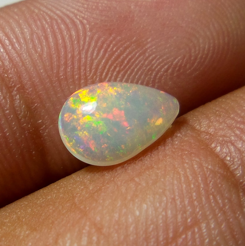 0.92 Carat 9.8x6.8x3.3 MM Rare Quality Ethiopian Multi Color Opal Pear Shape Cabochon