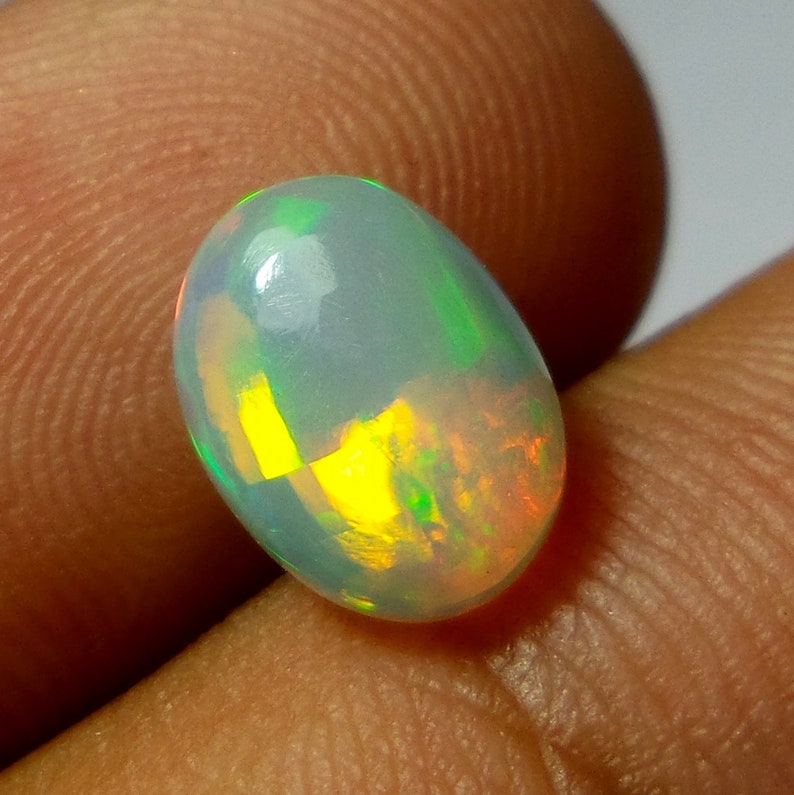Multi Color Welo Fire Opal Cabochon 1.53 Carat 10.1x7.6x3.9 MM AAA Grade Natural Ethiopian Welo Fire Opal Oval Shape Cabochon