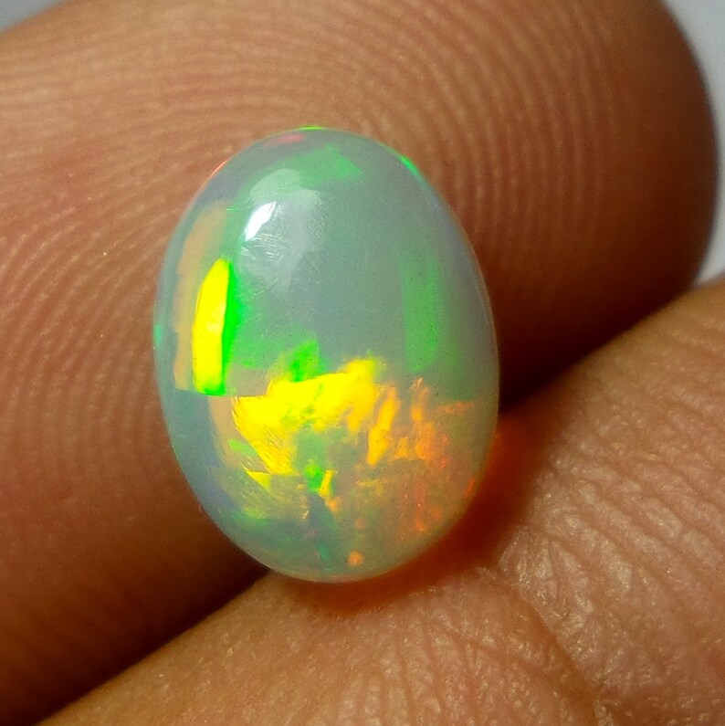 Multi Color Welo Fire Opal Cabochon 1.53 Carat 10.1x7.6x3.9 MM AAA Grade Natural Ethiopian Welo Fire Opal Oval Shape Cabochon