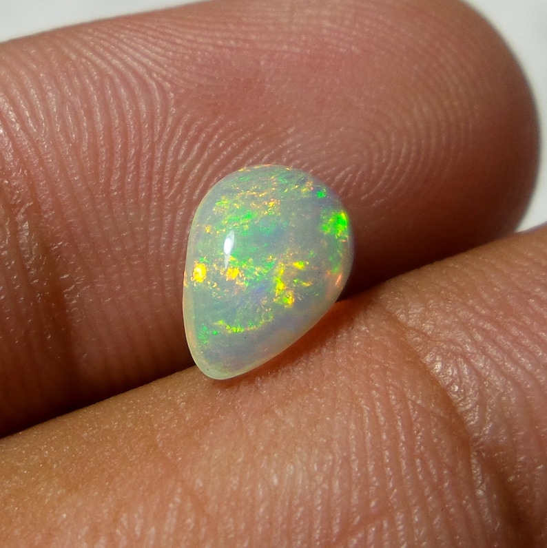0.92 Carat 9.8x6.8x3.3 MM Rare Quality Ethiopian Multi Color Opal Pear Shape Cabochon