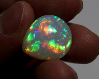 14.12 Carat 21x18.5x9.3 MM Natural AAAA Grade Green Red Yellow Rainbow Flashy Fire Ethiopian Opal Pear Shape Cabochon Gemstone