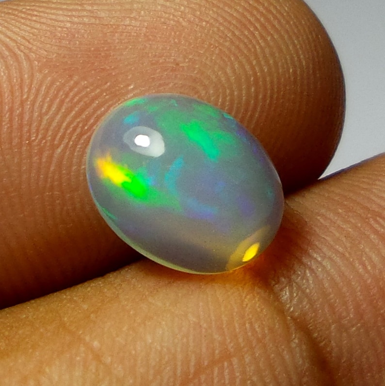2 Carat 11.2X8.9X5.1 MM AAA Grade Natural Ethiopian Welo Fire Opal Oval Shape Cabochon Multi Color Opal