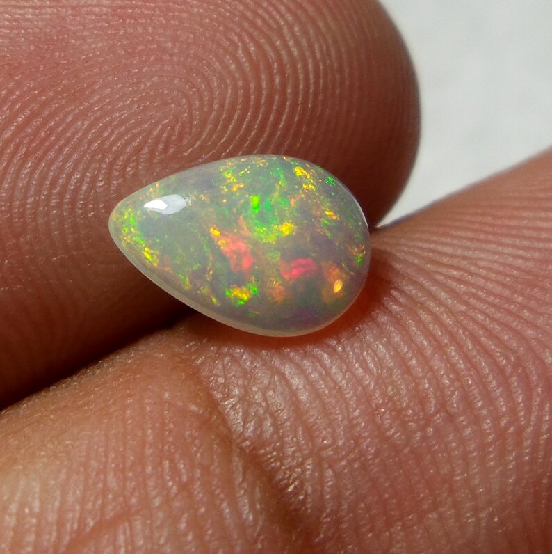 0.92 Carat 9.8x6.8x3.3 MM Rare Quality Ethiopian Multi Color Opal Pear Shape Cabochon