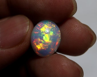 6.40 Carat 14.3x11.7x7.6 MM Natural AAA Grade White Base Multi Flashy Fire Ethiopian Opal Oval Shape Cabochon Gemstone For Jewellery Making