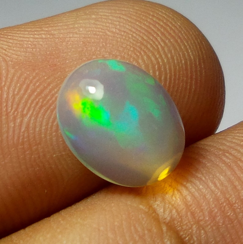 2 Carat 11.2X8.9X5.1 MM AAA Grade Natural Ethiopian Welo Fire Opal Oval Shape Cabochon Multi Color Opal
