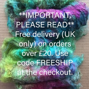 May include: Close-up of colorful, textured fiber in shades of green, blue, purple, and pink. The image includes the text: "IMPORTANT, PLEASE READ" and other text about free delivery.