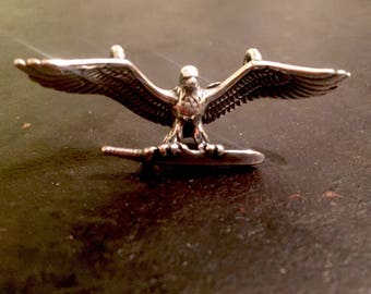 Flying eagle carrying a feather. Eagle charm made from silver alloy, native eagle charm, indian eagle pendent, eagle charm, eagle pendent