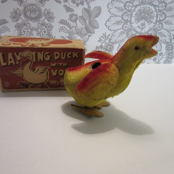 Antique Vintage - Japan Easter "Laying Duck with Voice" - Wind up to drop eggs. Pieces missing - needs a key - comes with original box.