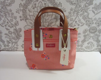 Leather conditioner application on Cath Kidston bag trim